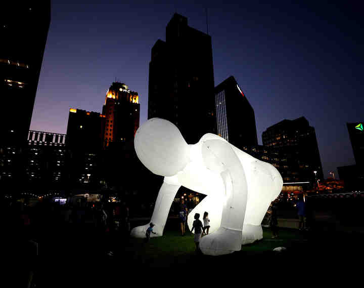 People check out one of the inflatable humanoid Fantastic Planet pieces during the Momentum Festival at Promenade Park in Toledo on Friday, September 14, 2018.  (Kurt Steiss / The Blade)